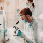 Laboratory professionals working at ergonomic technical workstations designed to improve comfort, safety, and productivity.