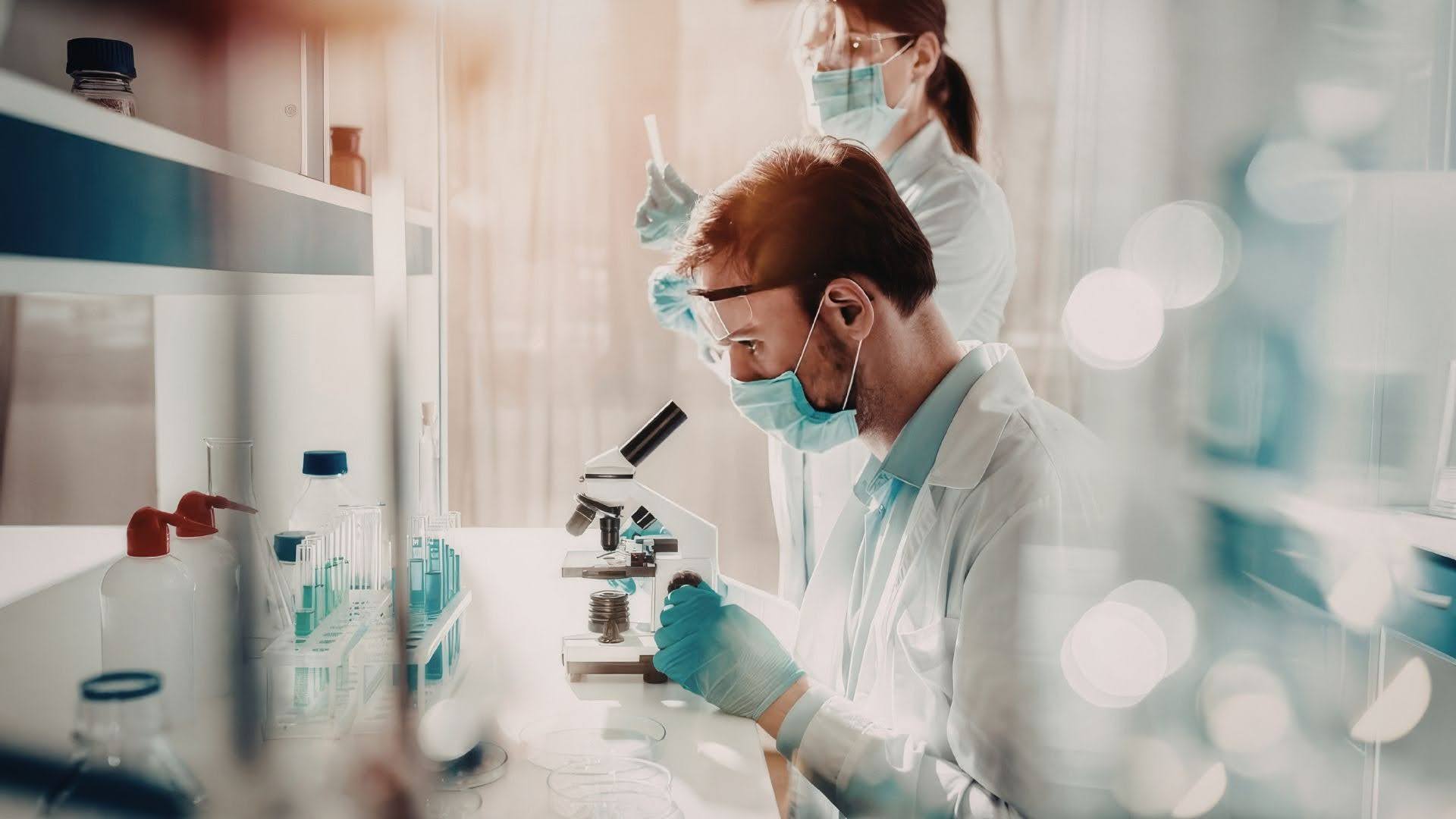 Laboratory professionals working at ergonomic technical workstations designed to improve comfort, safety, and productivity.