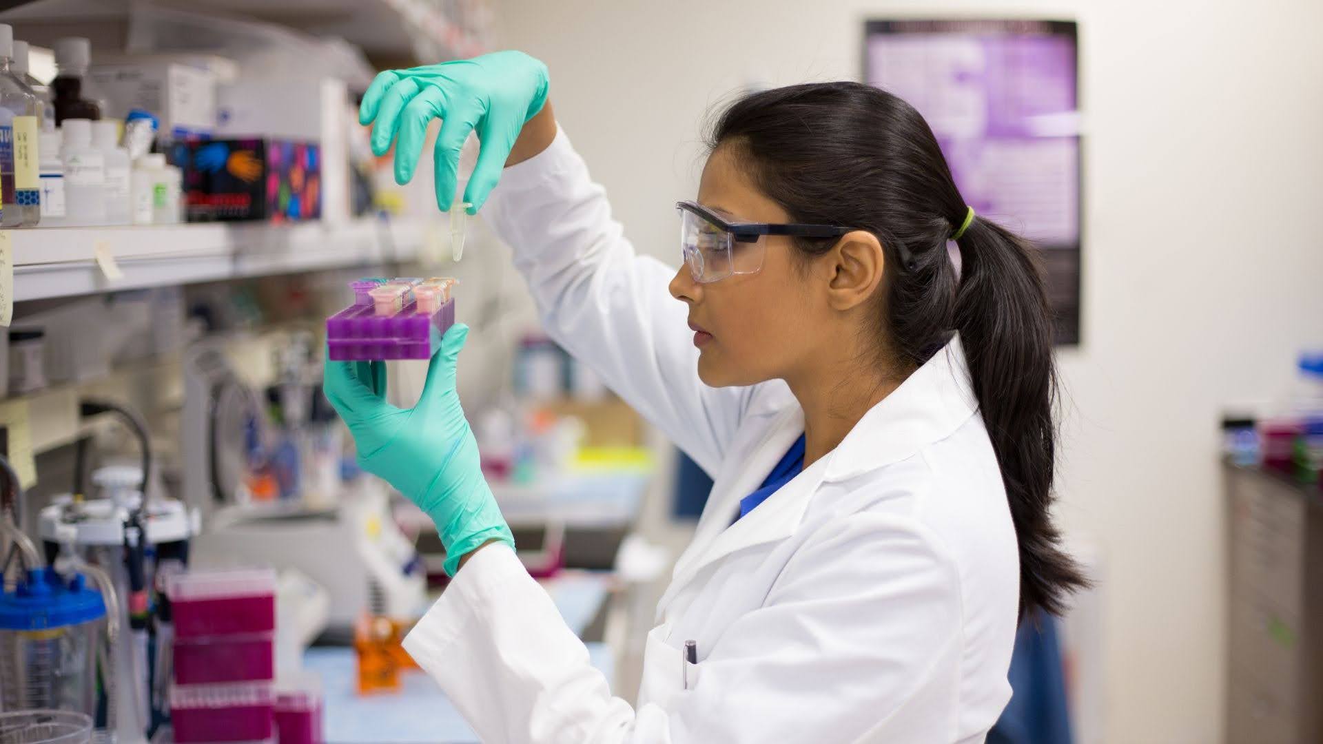 Laboratory technician working at a technical workstation, highlighting how workspace design affects productivity in manufacturing environments.