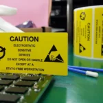 Electrostatic-sensitive electronic components at an ESD-safe workstation, highlighting the need for custom ESD workstations in electronics manufacturing.